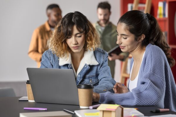 friends-learning-together-from-notes-laptop
